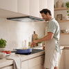 CIARRA black cooker hood installed in a modern European kitchen